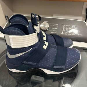 Navy and white Nike basketball shoes